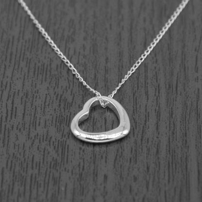 Sterling Silver Floating Heart Pendant Necklace on Curb Chain