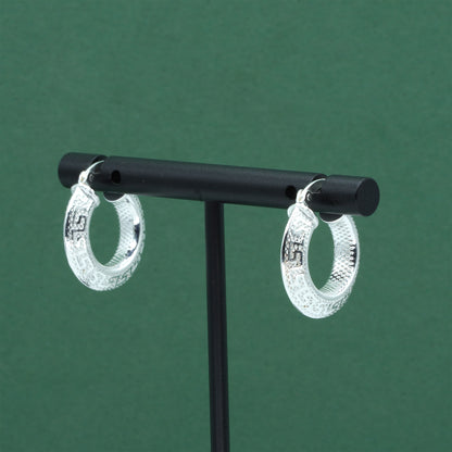 Sterling silver textured hoop earrings crafted from genuine 925 silver.  Patterned surface with chunky hoop profile. Hinged fastening.  Weight: 2g Inner diameter: 10mm Outer diameter: 19mm Width: 4mm  Solid 925 sterling silver.