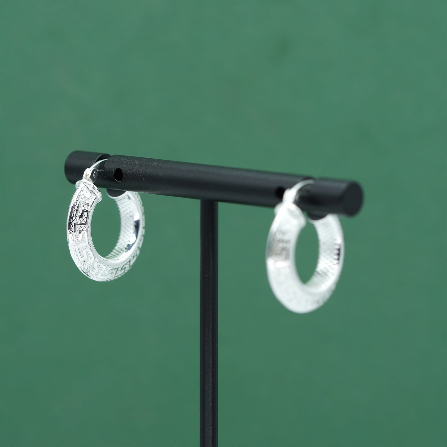 Sterling silver textured hoop earrings crafted from genuine 925 silver.  Patterned surface with chunky hoop profile. Hinged fastening.  Weight: 2g Inner diameter: 10mm Outer diameter: 19mm Width: 4mm  Solid 925 sterling silver.