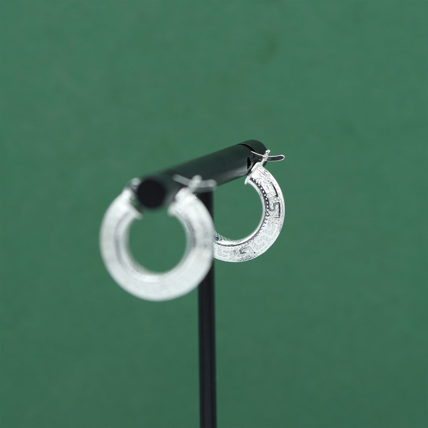 Sterling silver textured hoop earrings crafted from genuine 925 silver.  Patterned surface with chunky hoop profile. Hinged fastening.  Weight: 2g Inner diameter: 10mm Outer diameter: 19mm Width: 4mm  Solid 925 sterling silver.