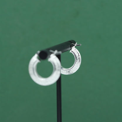 Sterling silver textured hoop earrings crafted from genuine 925 silver.  Patterned surface with chunky hoop profile. Hinged fastening.  Weight: 2g Inner diameter: 10mm Outer diameter: 19mm Width: 4mm  Solid 925 sterling silver.