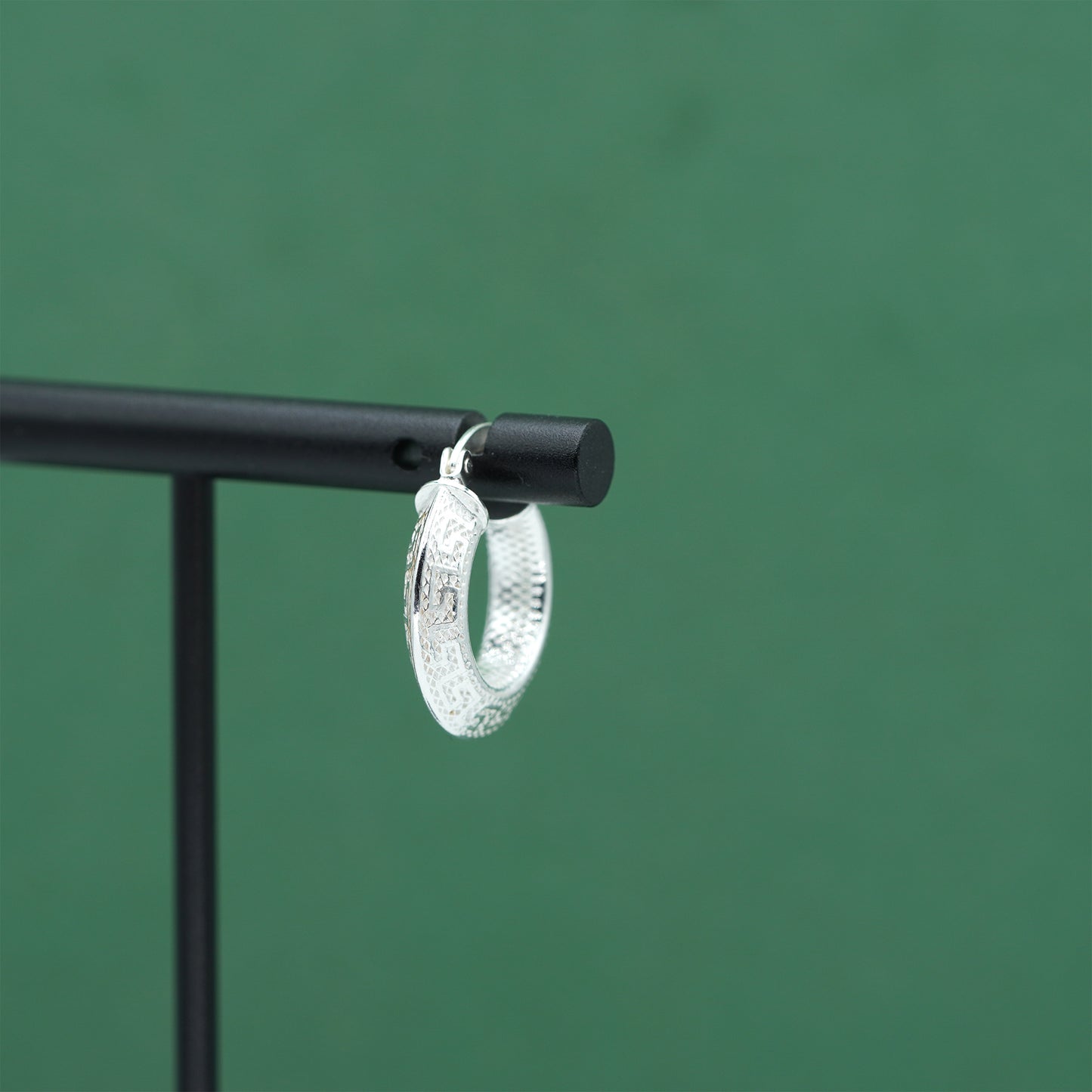 Sterling silver textured hoop earrings crafted from genuine 925 silver.  Patterned surface with chunky hoop profile. Hinged fastening.  Weight: 2g Inner diameter: 10mm Outer diameter: 19mm Width: 4mm  Solid 925 sterling silver.