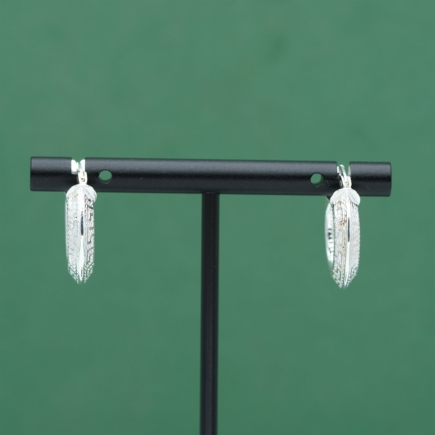 Sterling silver textured hoop earrings crafted from genuine 925 silver.  Patterned surface with chunky hoop profile. Hinged fastening.  Weight: 2g Inner diameter: 10mm Outer diameter: 19mm Width: 4mm  Solid 925 sterling silver.